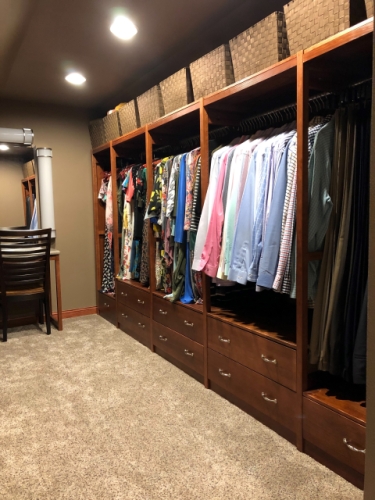 Solid wood closet system in a cherry finish