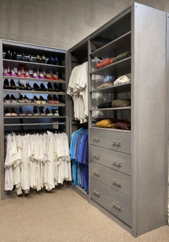 Solid wood closet organizer in painted white with adjustable shelving